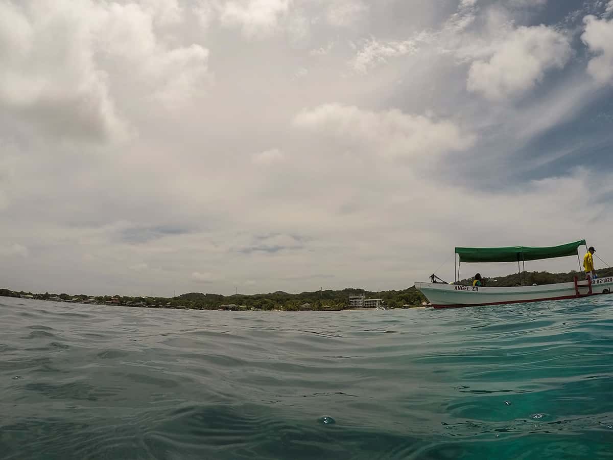 looking back towards our boat and the island of roatan during our snorkeling tour