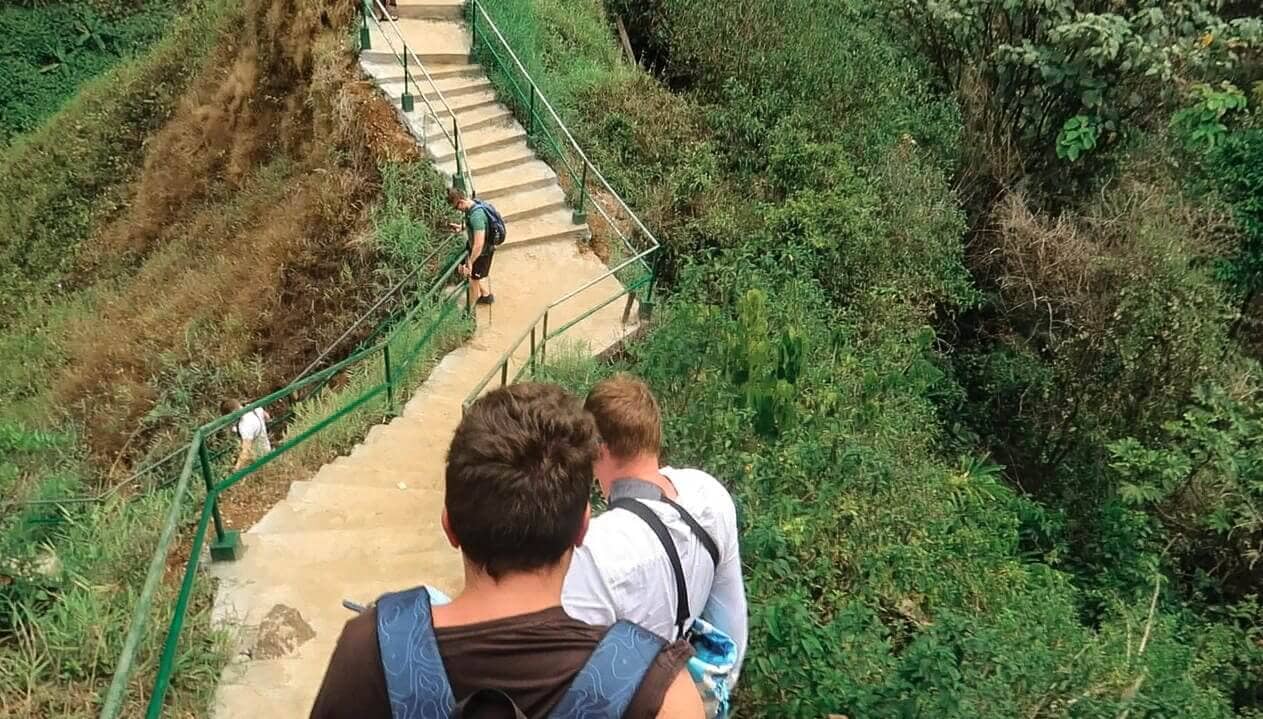 climbing down the staircase to tad yuang waterfall