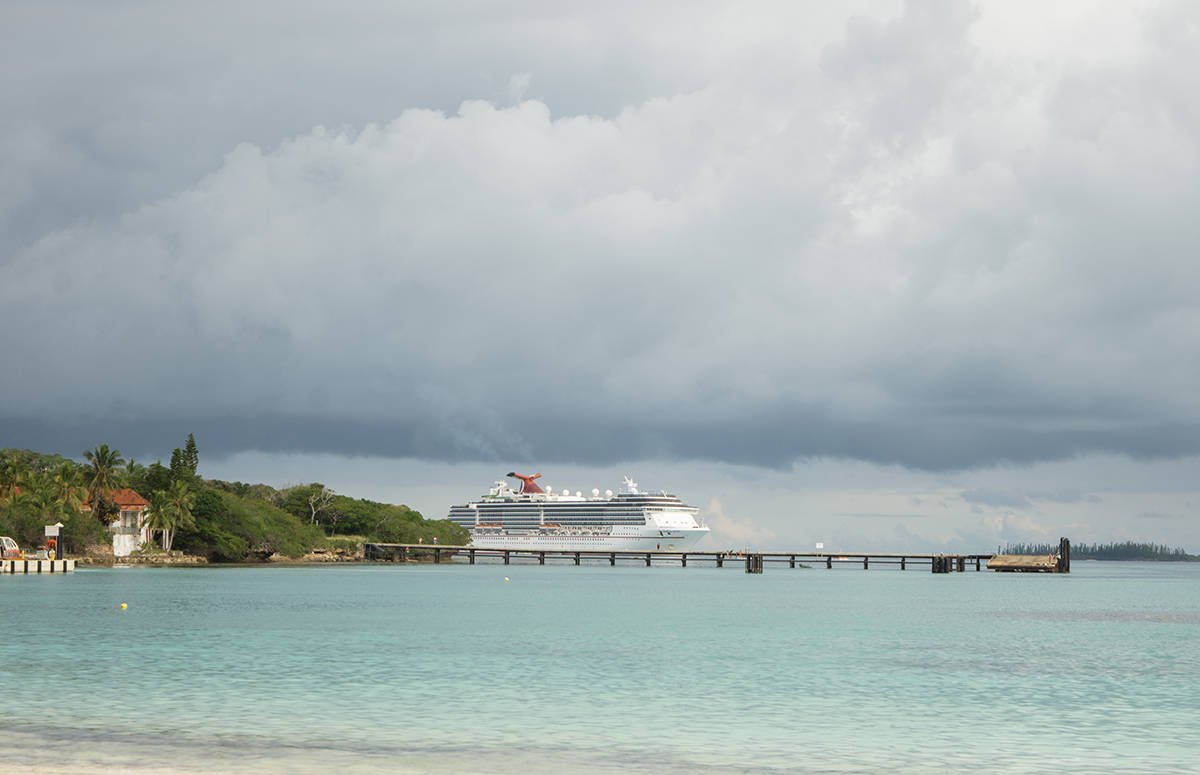 looking out over the stormy skies of kuto bay to our carnival spirit cruise ship