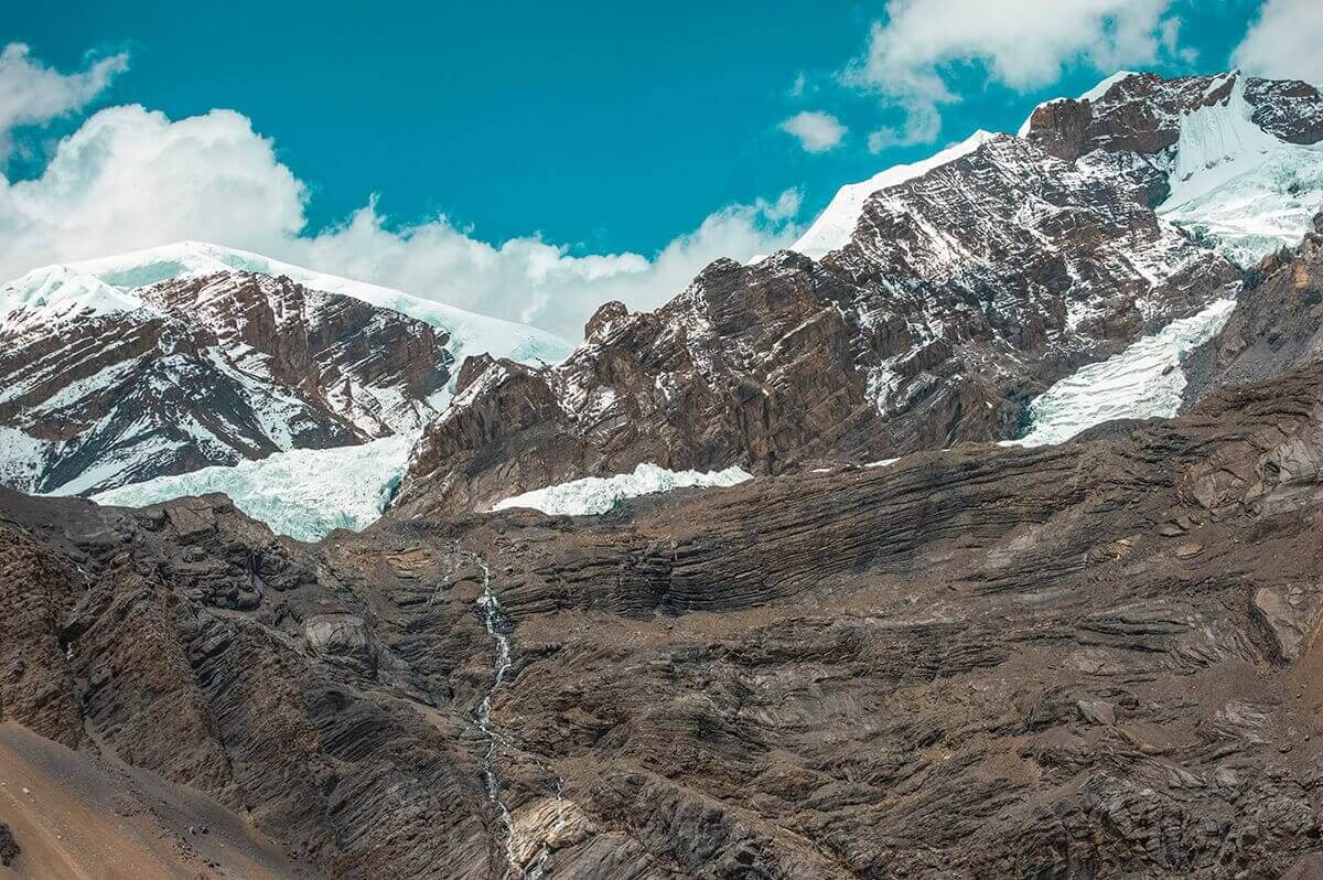 waterfall and snow throng phedi to high camp on the annapurna circuit