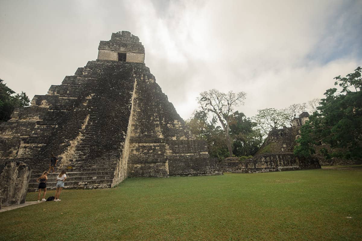 checking out the great jaguar temple from inside the grand plaza on our tikal tour from flores