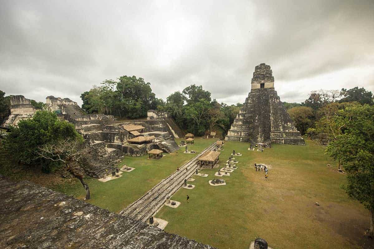 standing on top of temple II in the grand plaza on our tikal tour from flores