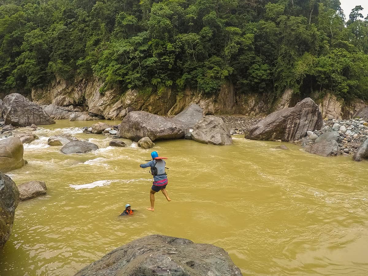 jumping off one of the boulders into the cangrejal river