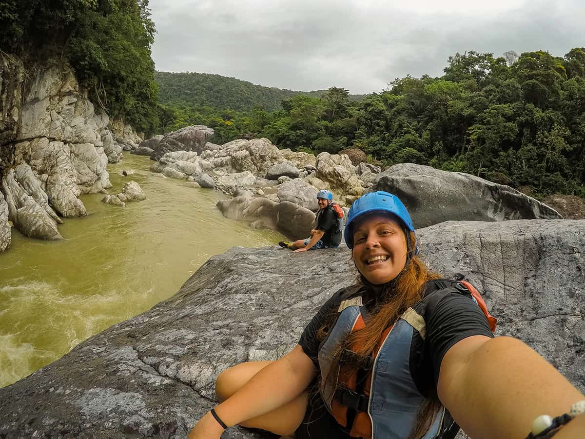 a cheeky selfie while taking a break from boulder jumping on our white water rafting tour in honduras