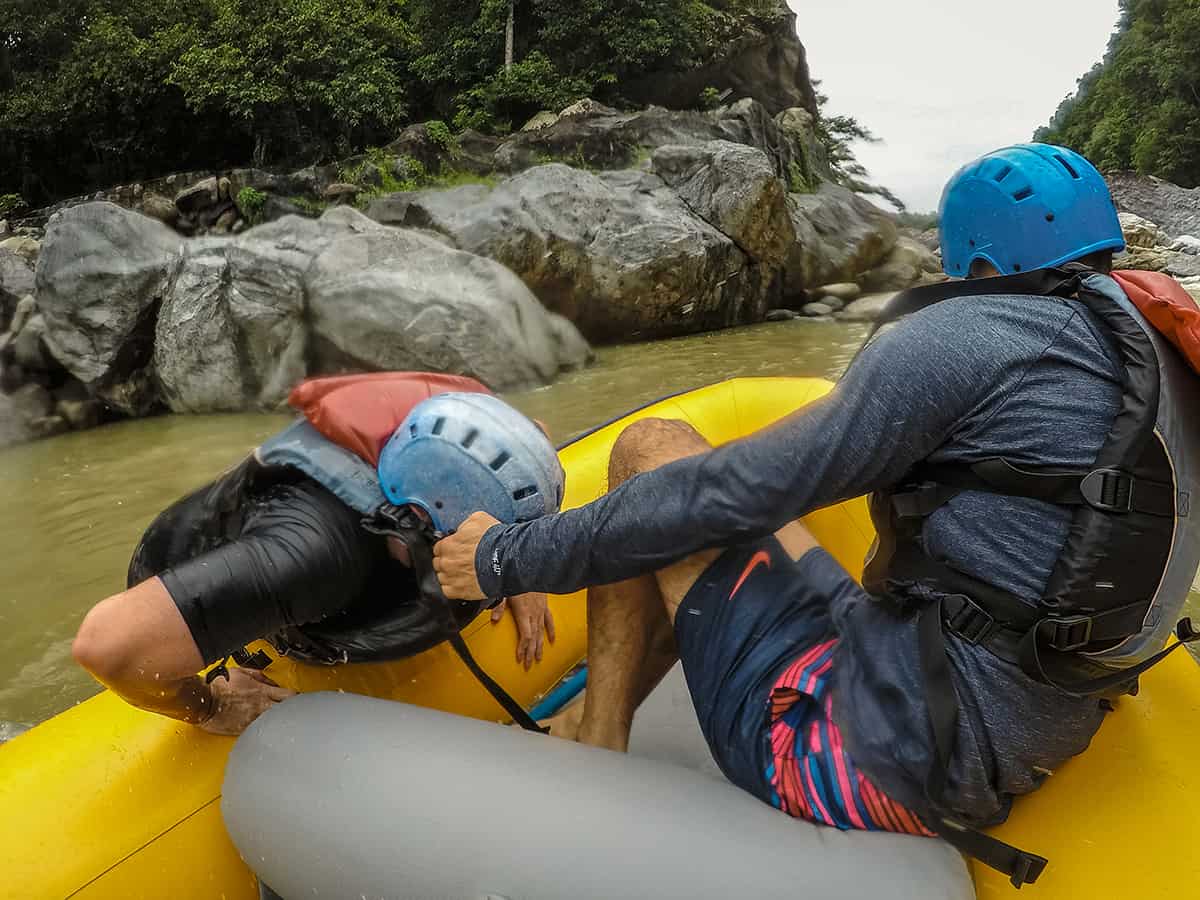 getting pulled back in the raft after going overboard on one of the rapids