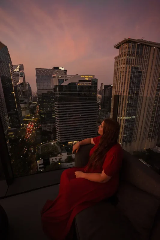 enjoying the sky changing color and the streets lighting up during nightfall from a bangkok skybar