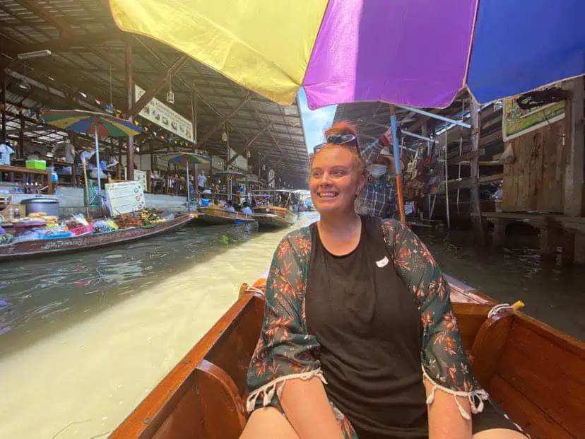 tasha amy on a boat at the Damnoen Saduak floating Market in bangkok