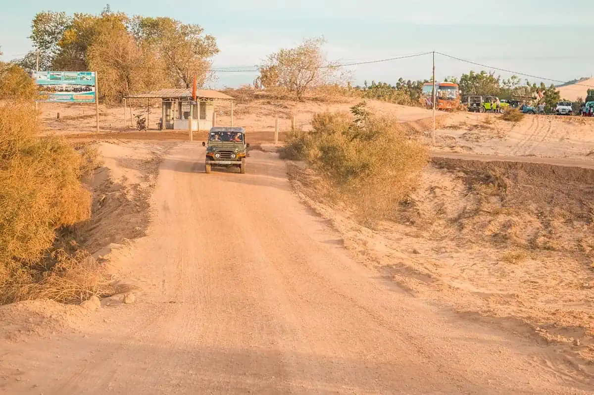 jeeps on the sunrise tour leaving the white sand dunes while in mui ne