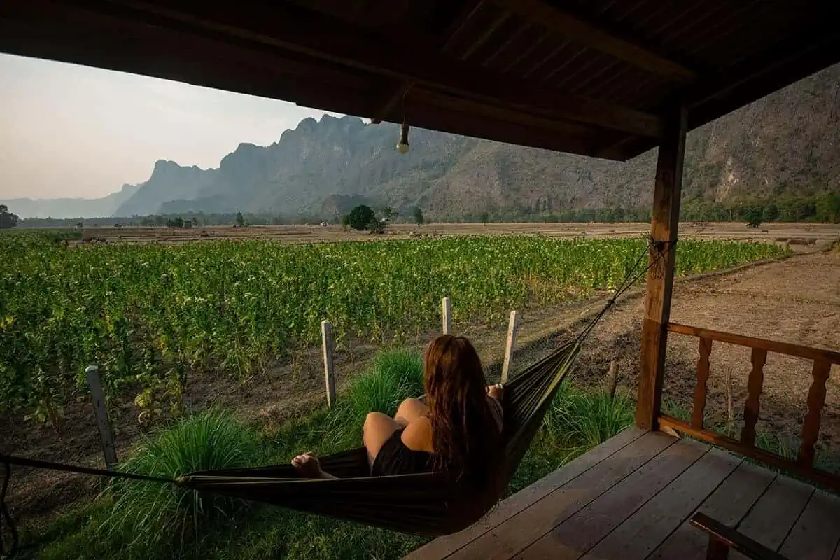 tasha amy sitting on hammock in kong lor on her 2 weeks in laos itinerary