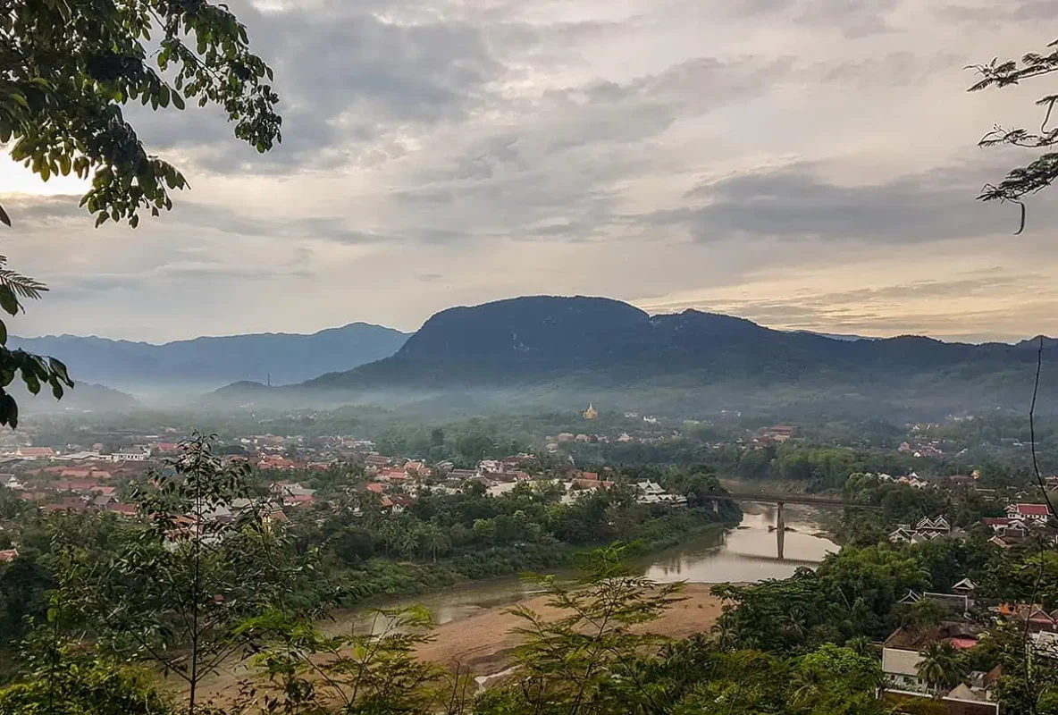 3 Days In Luang Prabang Itinerary: ULTIMATE Guide 4 looking over the town of luang prabang from mount phousi on a cloudy morning