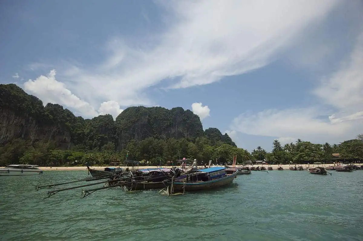 local thai longtail boats while arriving at railay beach