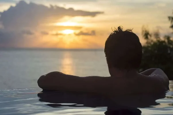 enjoying sunset in koh phi phi in an infinity pool during 3 weeks in thailand itinerary