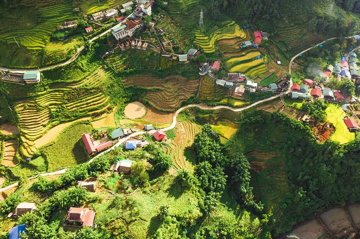 Aerial view of terraced rice fields in Sapa, a rural landscape that's a staple in a Vietnam itinerary 3 weeks.