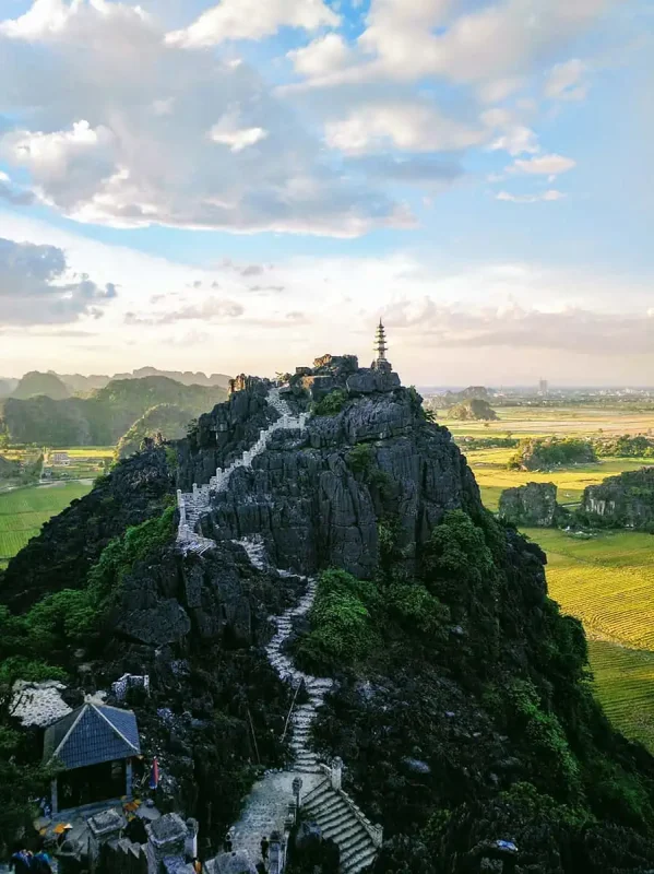 Ancient pagoda atop a rocky mountain in Ninh Binh, a breathtaking climb to include in your 3 weeks in Vietnam itinerary.