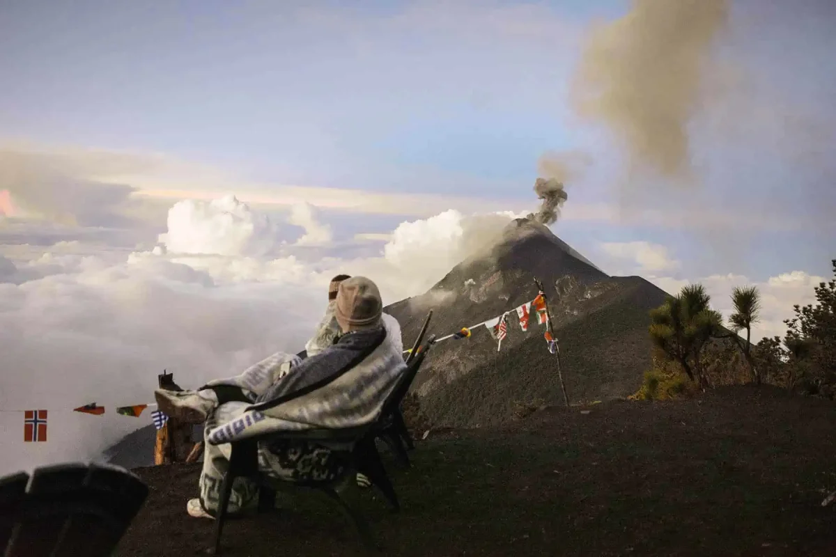 wrapped up in warm blankets watch fuego volcano erupt on a chilly morning