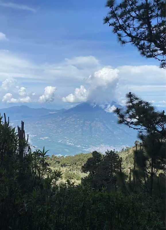 epic views furing the guatemala flats section of the acatenango volcano hike over to volcan de agua and the town of antigua