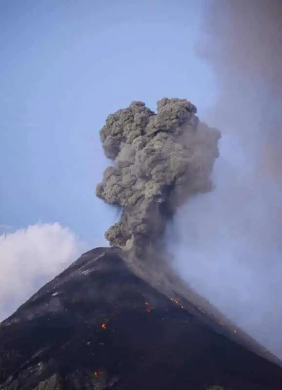 watching sunrise over volcan fuego while it erupts