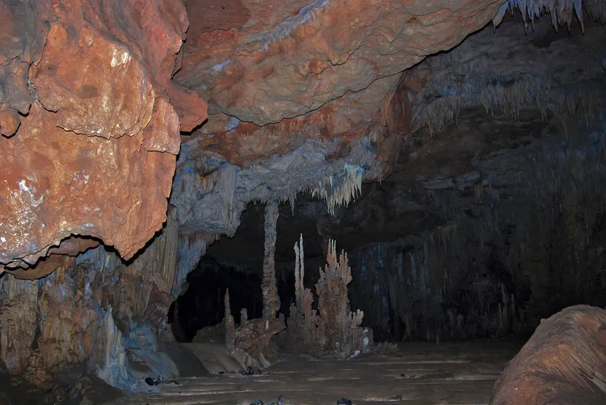 checking out the stalagmites and stalactites growing in a more open section of the atm cave