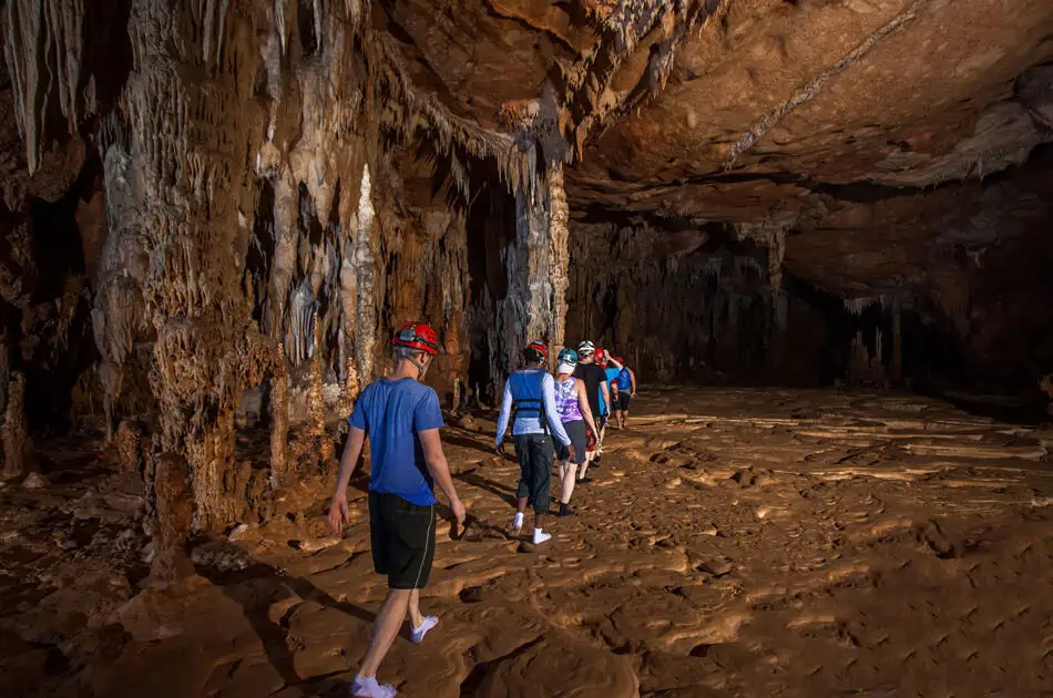 hiking through a more open and flat section on the atm cave tour belize
