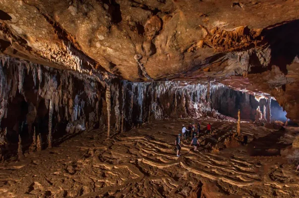 walking through one of the main caverns on the atm cave tour belize from san ignacio