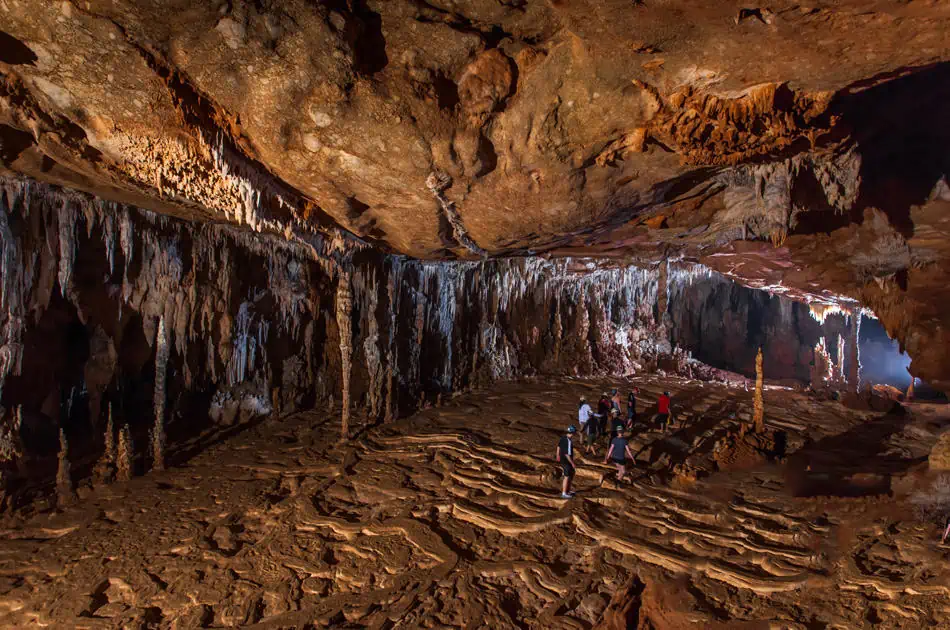 walking through one of the main caverns on the atm cave tour belize from san ignacio
