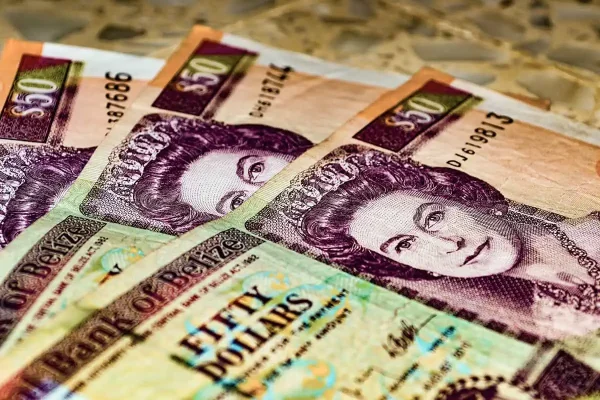 the currency in belize which you can get from atms in caye caulker