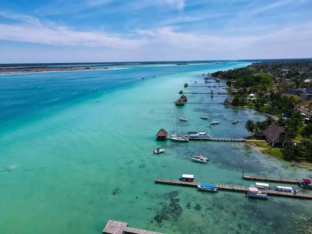 Bacalar To Caye Caulker: The ULTIMATE Travel Guide 2025 7 Aerial view of Bacalar's lagoon with clear waters stretching into the distance. Your starting point on the bacalar to caye caulker journey.