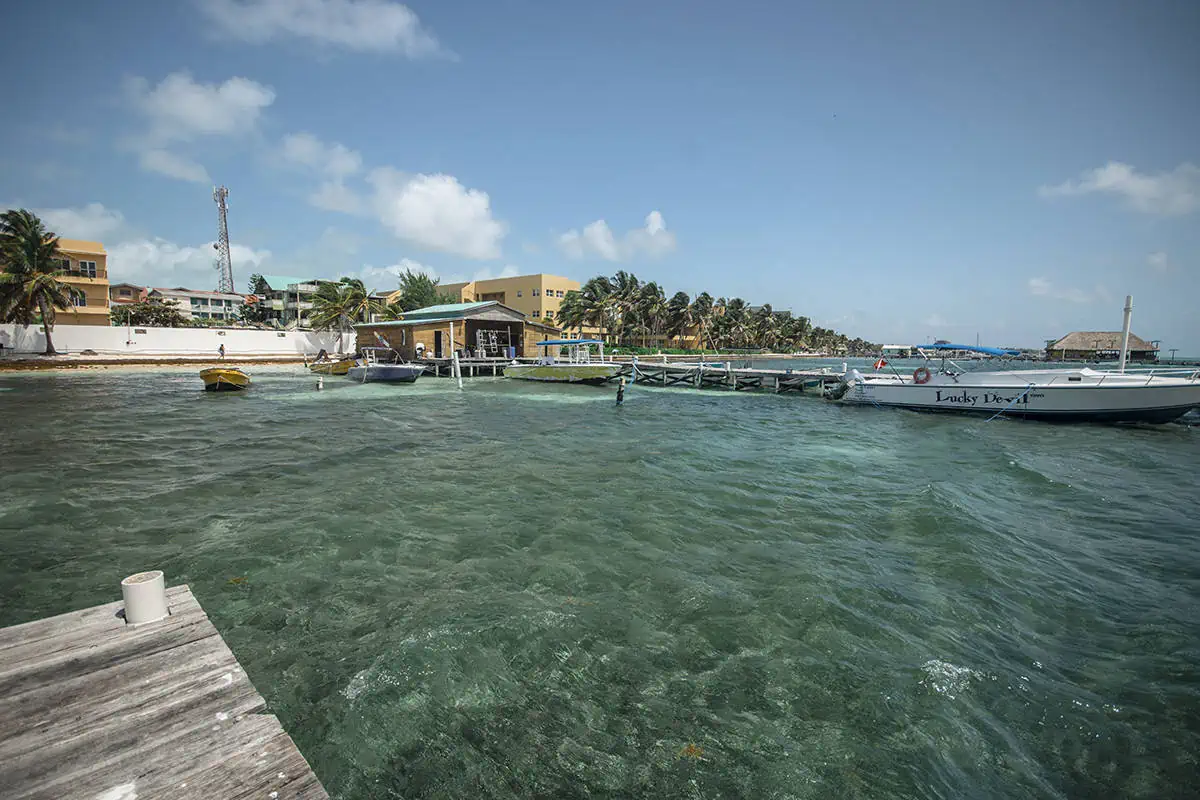 on our ferry from san pedro to caye caulker looking back at the island while backpacking belize