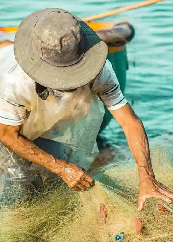 watching locals doing their work at the fishing village in mui ne