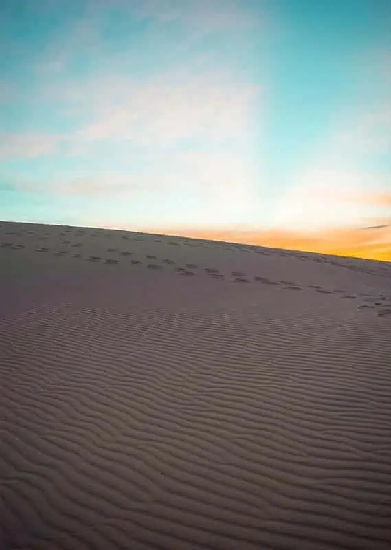 watching the sunrise over the white sand dunes in mui ne