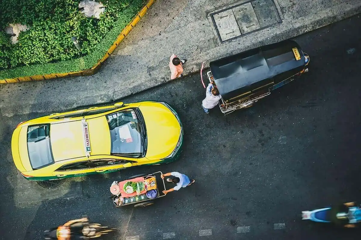 birds eye view of taxi driving in bangkok traffic