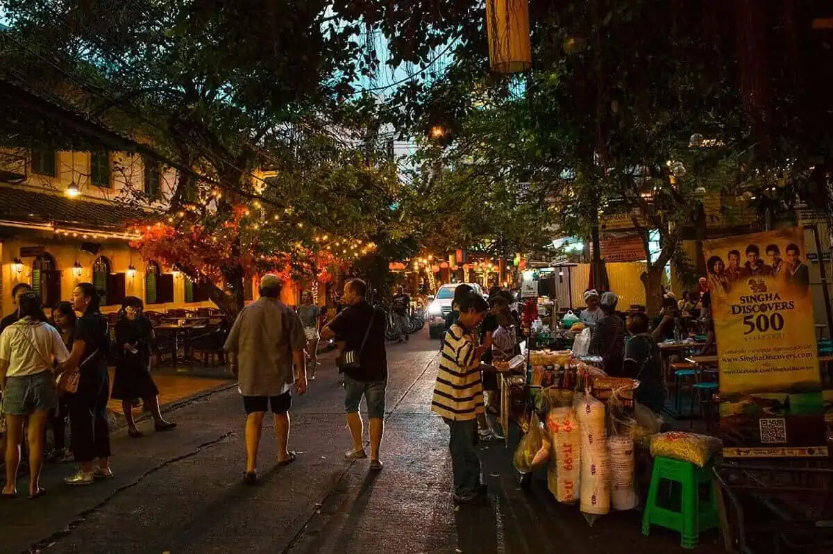 people walking down khao san road in bangkok