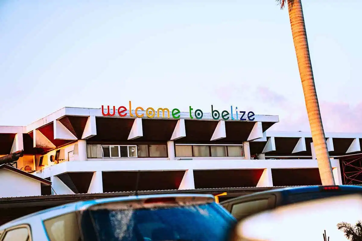 The iconic 'Welcome to Belize' sign on a modern building, a greeting landmark for visitors on their way from Belize airport