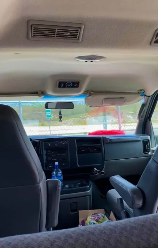 Interior of a transport vehicle with a clear view through the windshield, when driving from mexico to belize city