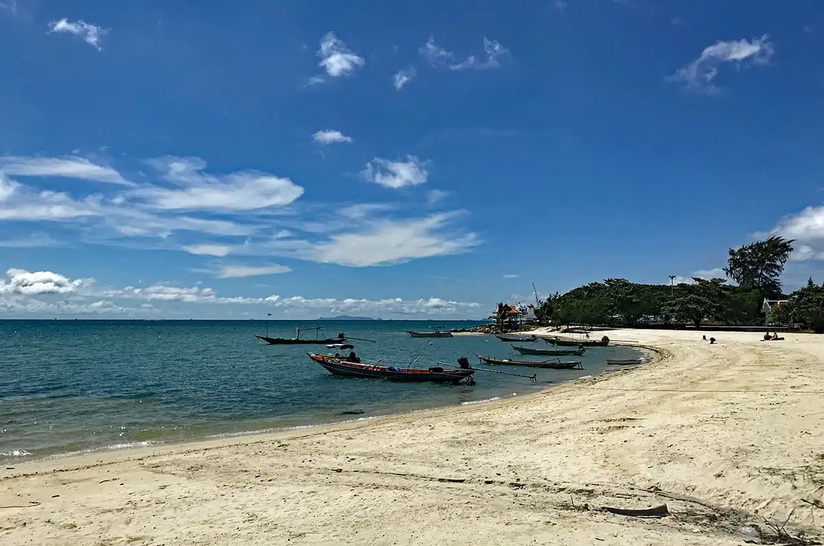 the beach of the main township thong sala with fishing boats lined up