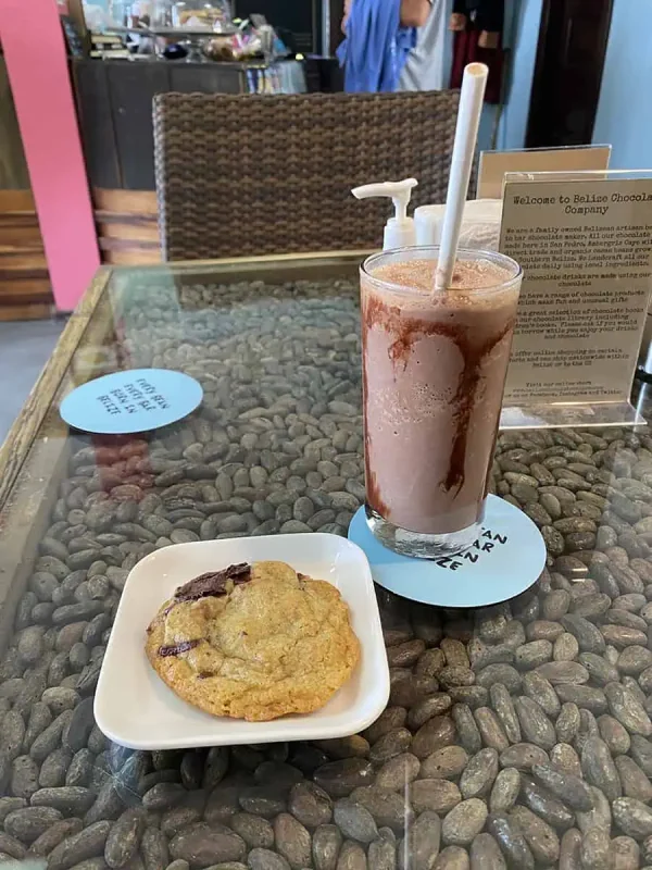 A refreshing chocolate milkshake and cookie from the Belize Chocolate Company in Ambergris Caye, inviting visitors to enjoy local treats.