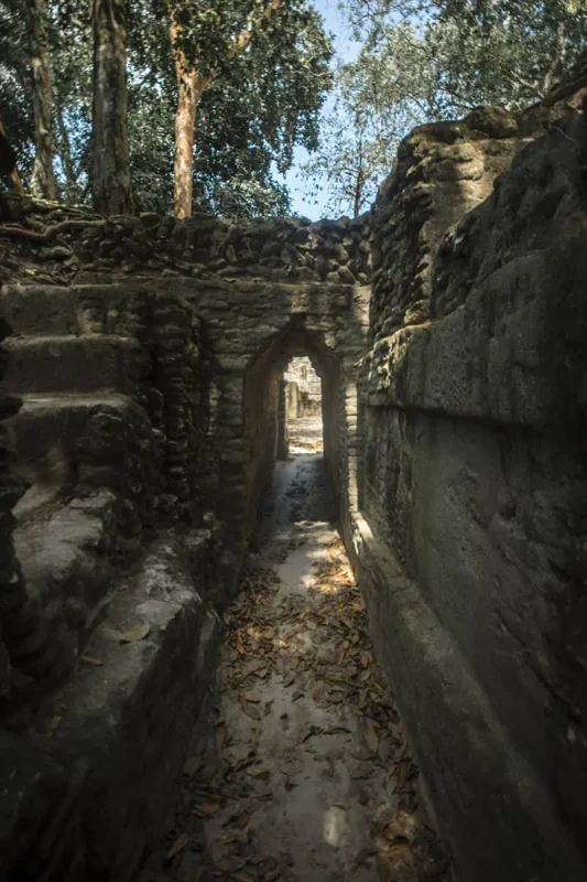 Cahal Pech Mayan Ruins In San Ignacio: A Hidden Gem Away from the Crowds 5 looking through one of the doorways and step staircases at cahal pech mayan ruins
