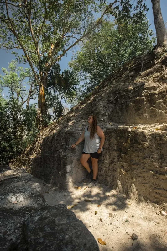 Cahal Pech Mayan Ruins In San Ignacio: A Hidden Gem Away from the Crowds 18 tasha amy finding a little bit of shade while exploring one of the temples at cahal pech mayan ruins