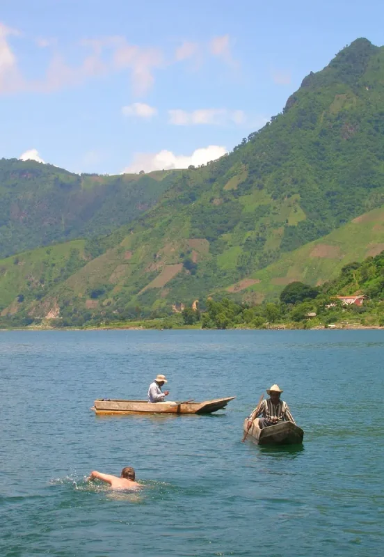 swimming out to local fisherman on lake atitlan