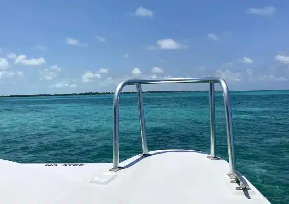 The scenic view of the ocean from the back of a boat sailing from Caye Caulker to Belize City.