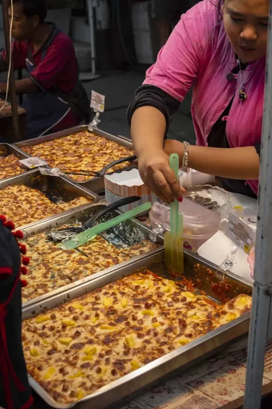various types of lasagne dishes, being prepared at the Sunday Night Market.
