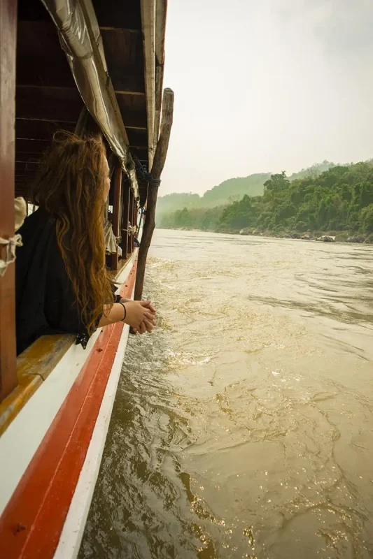 tasha amy looking out of the slow boat from chiang mai to luang prabang