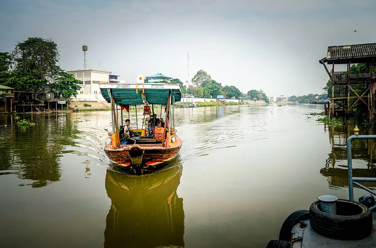 exploring the canals in ayutthaya by local river boat
