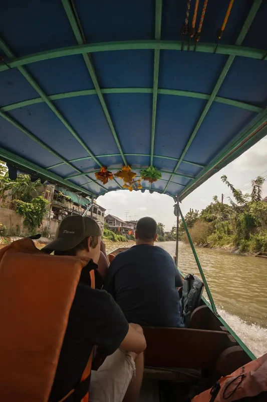 taking a boat through the canals on our ayutthaya day trip