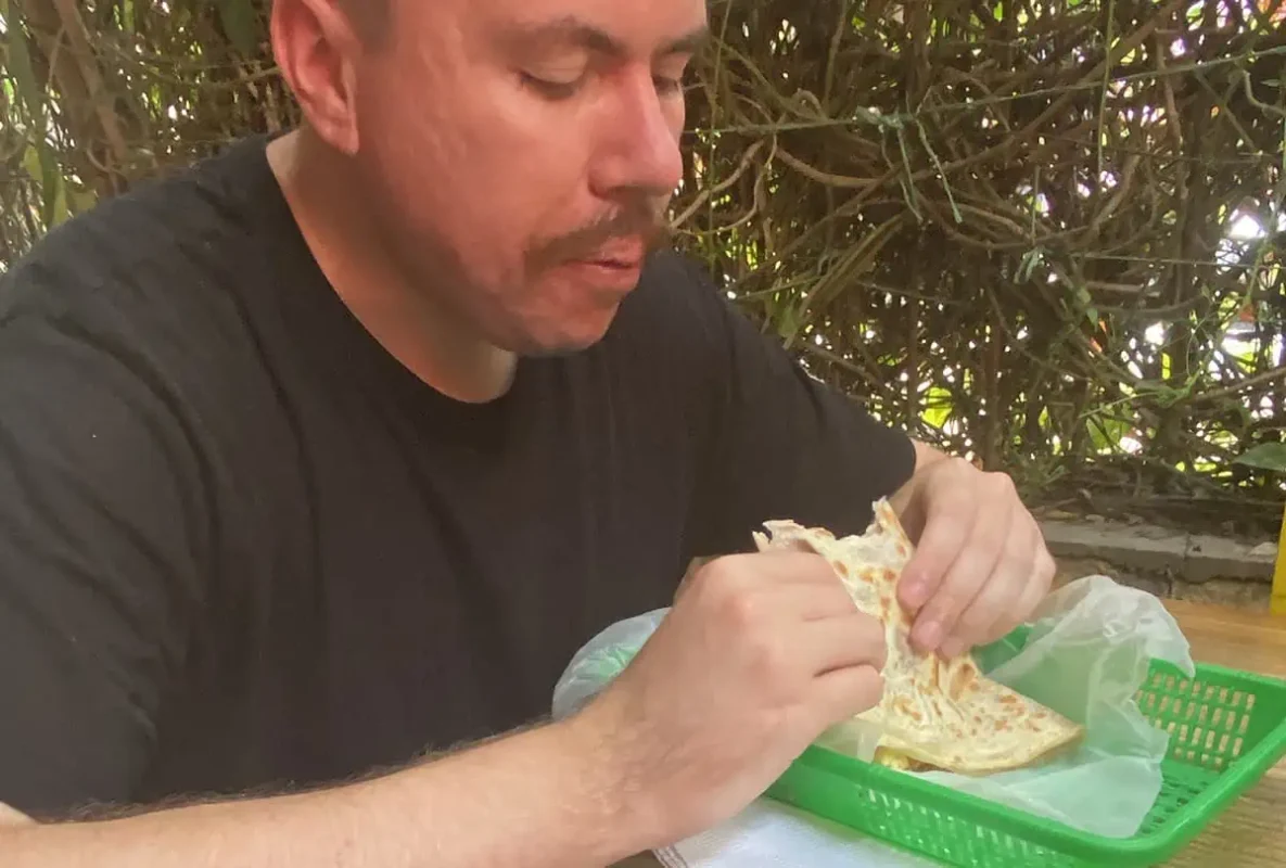 eating a baleada, a staple streetfood in honduras