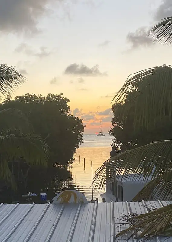 Sunset view over the peaceful waters near Caye Caulker, with safety and serenity as key aspects of the island's allure for evening relaxation.