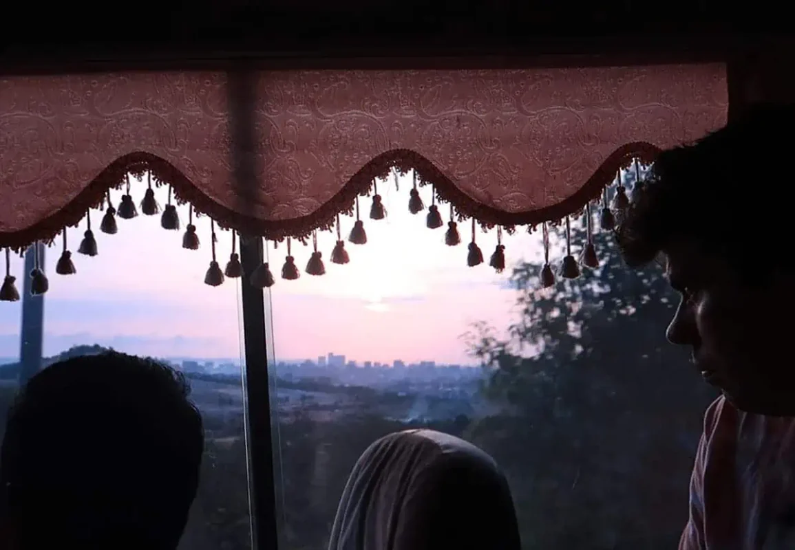 looking over to the city of sihanoukville at sunset in the distance