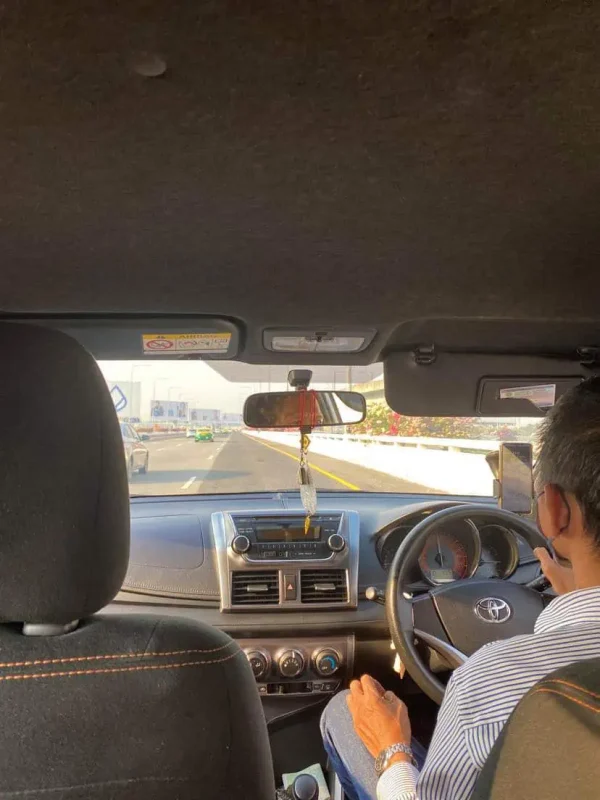 taking a grab taxi from khao san road to suvarnabhumi airport in bangkok