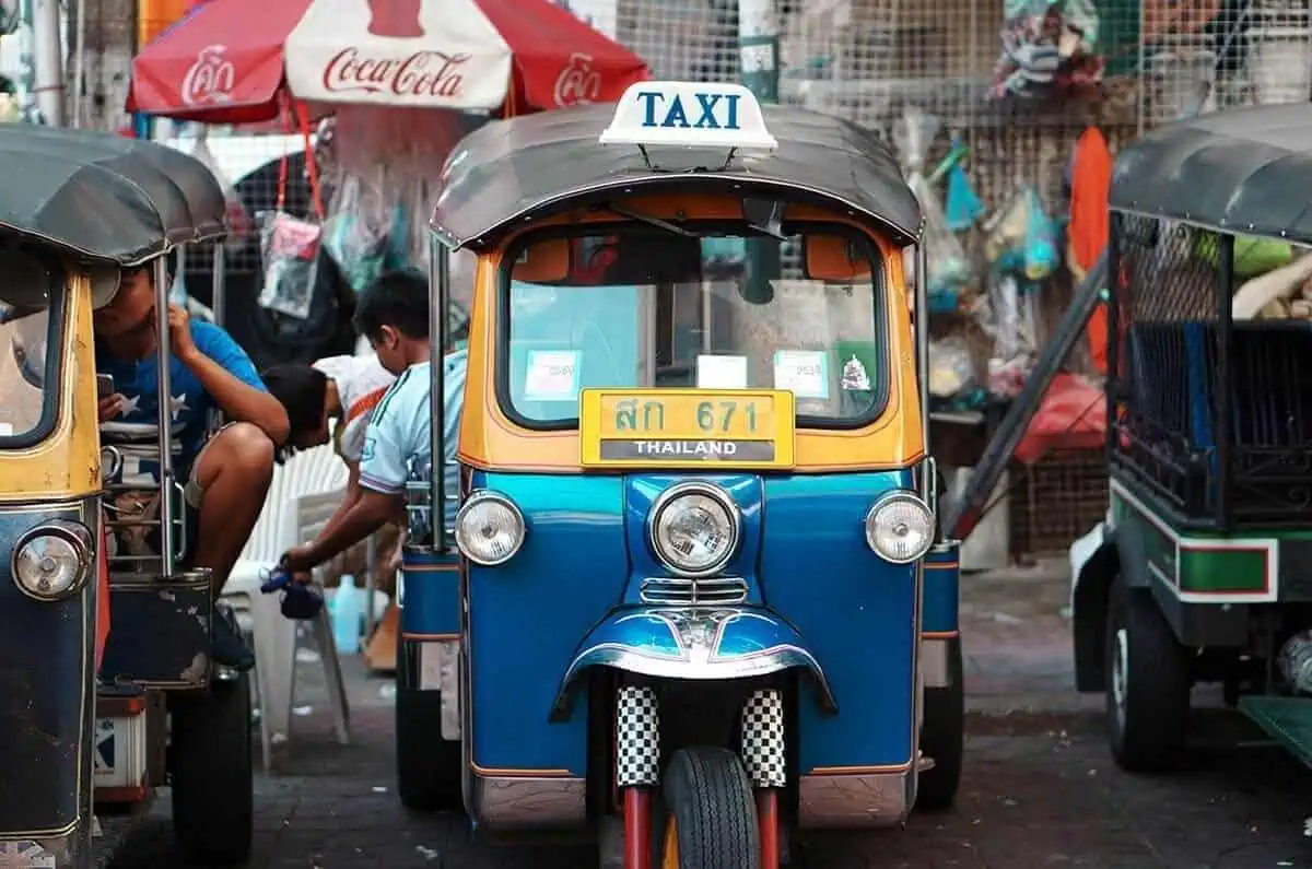 taking a tuk tuk from khao san road to airport bangkok