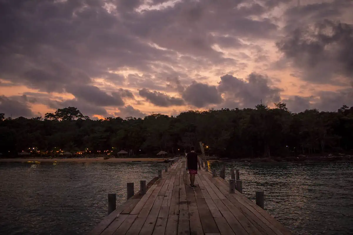 walking back down the pier at sunset to our bungalow on koh rong